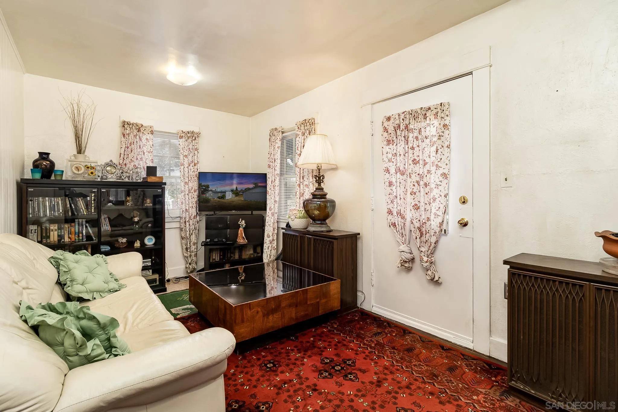 7054 Lisbon Street San Diego, CA 92114 - Photo 14 of 38 a living room with furniture and a fireplace
