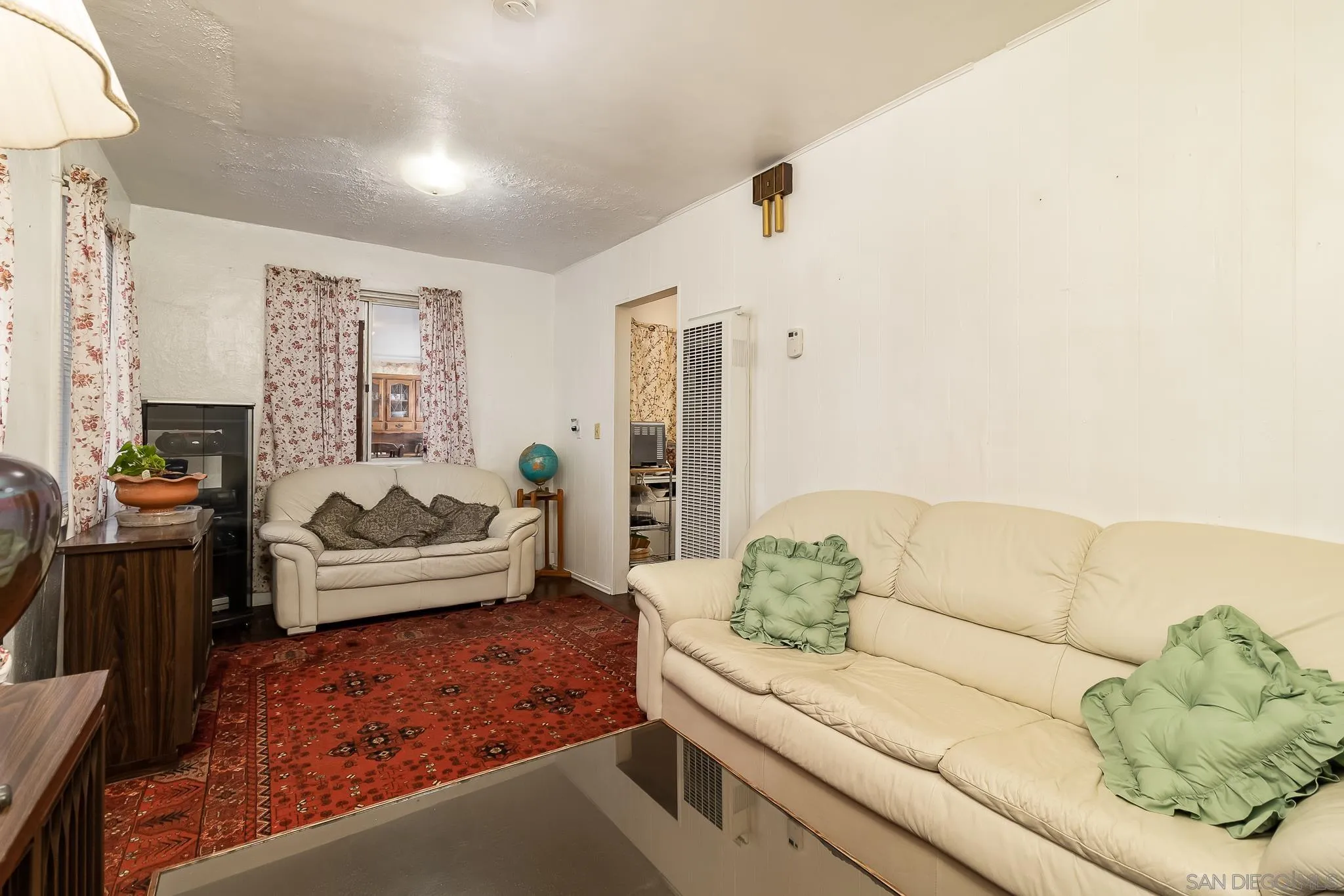 7054 Lisbon Street San Diego, CA 92114 - Photo 15 of 38 a living room with furniture and a couch