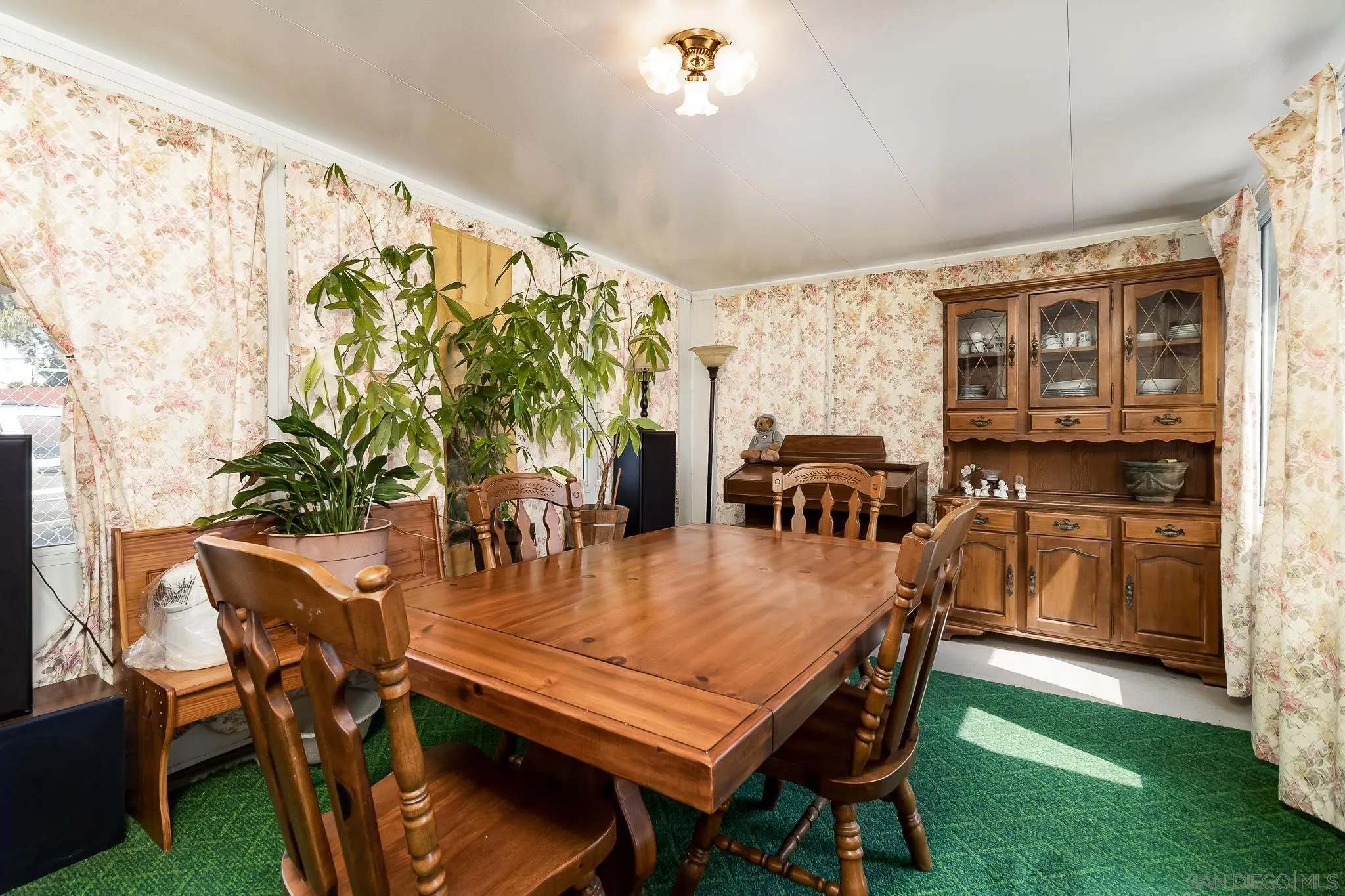 7054 Lisbon Street San Diego, CA 92114 - Photo 19 of 38 a dining room with furniture and window