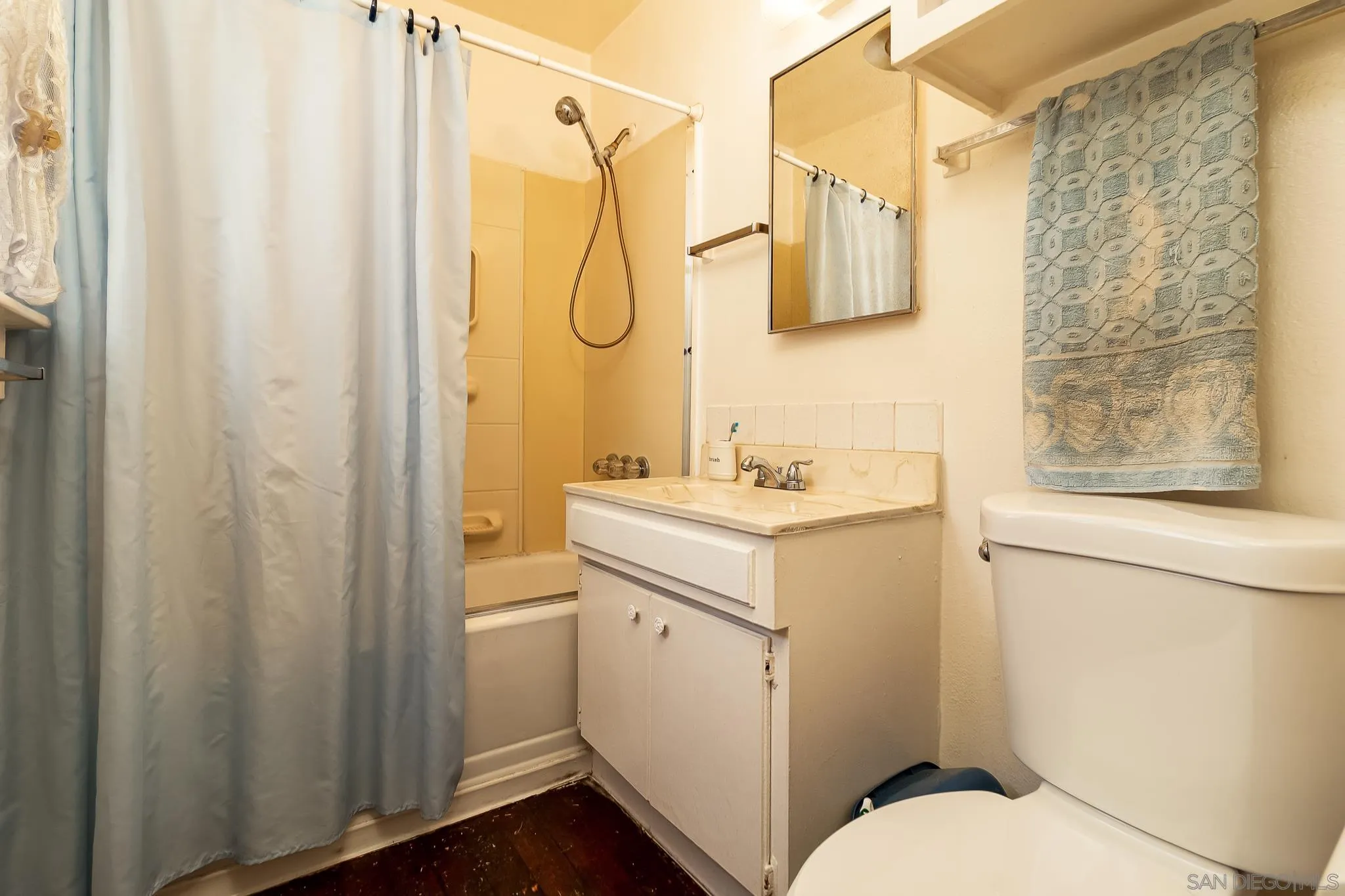 7054 Lisbon Street San Diego, CA 92114 - Photo 21 of 38 a bathroom with a sink a toilet and shower