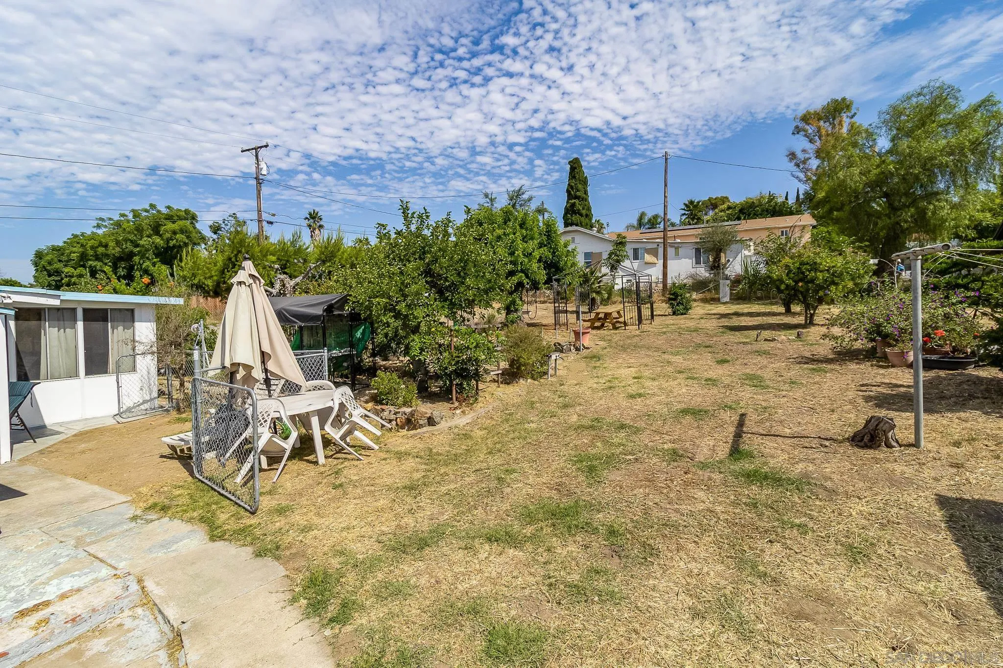 7054 Lisbon Street San Diego, CA 92114 - Photo 26 of 38 a view of a backyard with sitting area