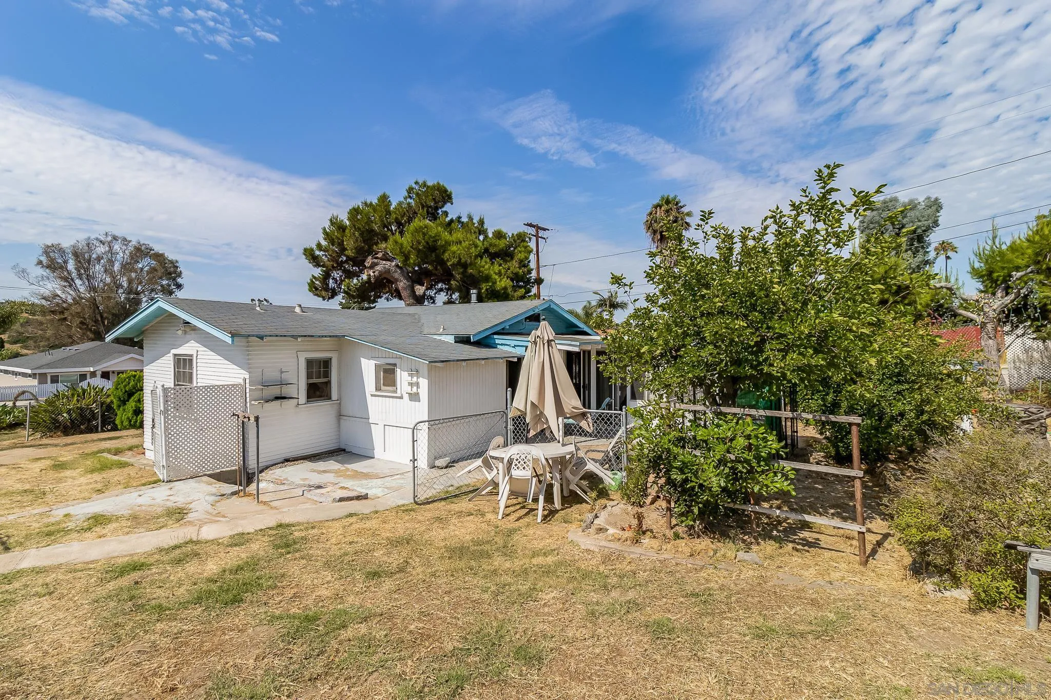 7054 Lisbon Street San Diego, CA 92114 - Photo 28 of 38 a view of a house with a yard