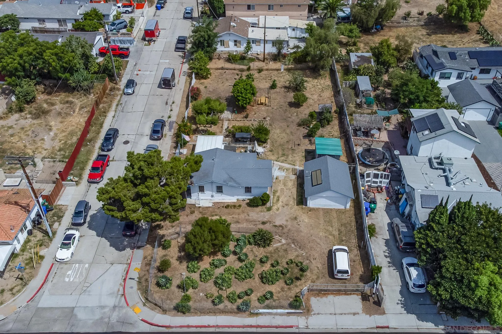 7054 Lisbon Street San Diego, CA 92114 - Photo 4 of 38 an aerial view of a house with a yard and garden