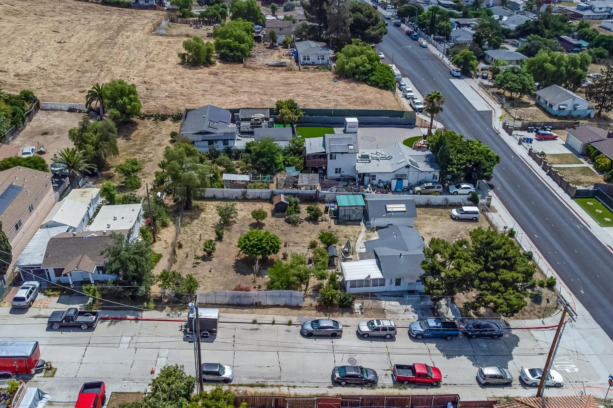 7054 Lisbon Street San Diego, CA 92114 - Photo 5 of 38 an aerial view of multiple houses with yard