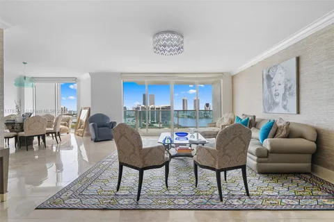 a living room with furniture a rug and a table