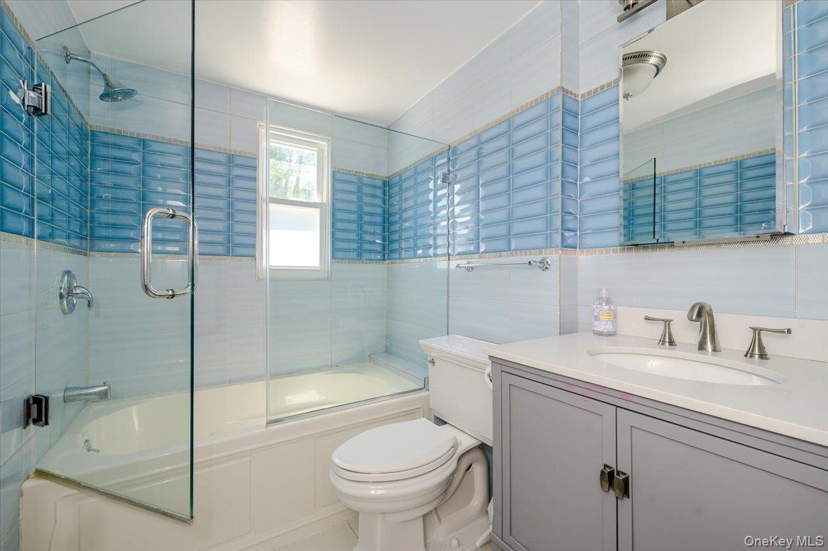 70 Longfellow Road Great Neck, NY 11023 - Photo 24 of 28 a bathroom with a sink toilet and shower