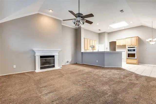 a view of a kitchen with a sink and a fireplace