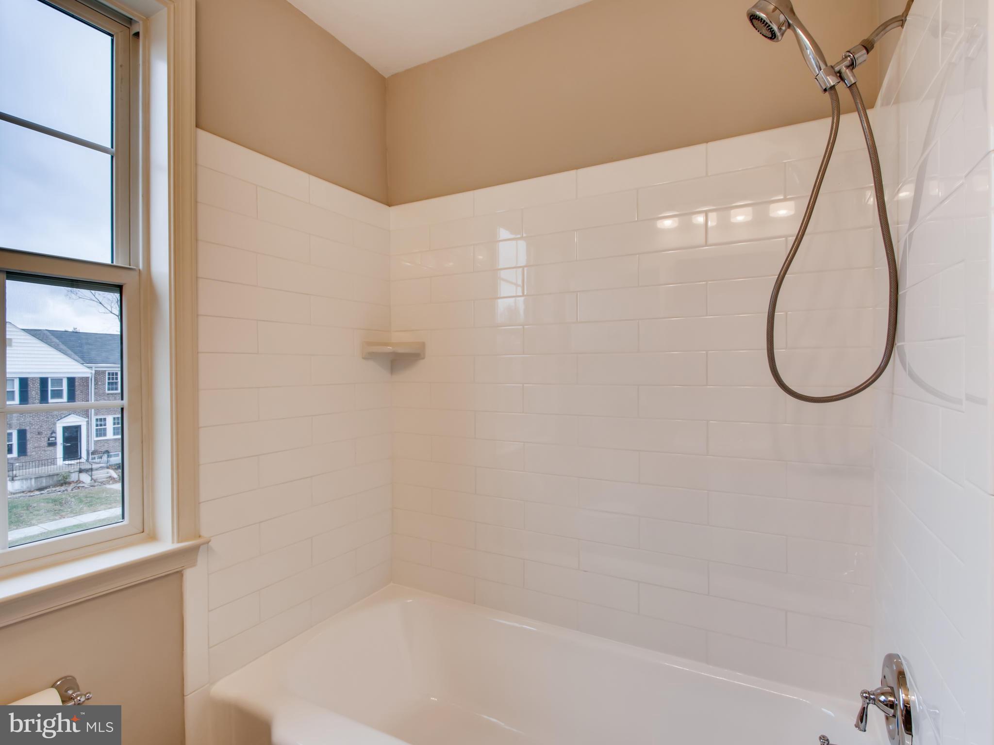 1904 Edgewood Road Baltimore, MD 21286 - Photo 11 of 17 Beautiful new white tile surround.
