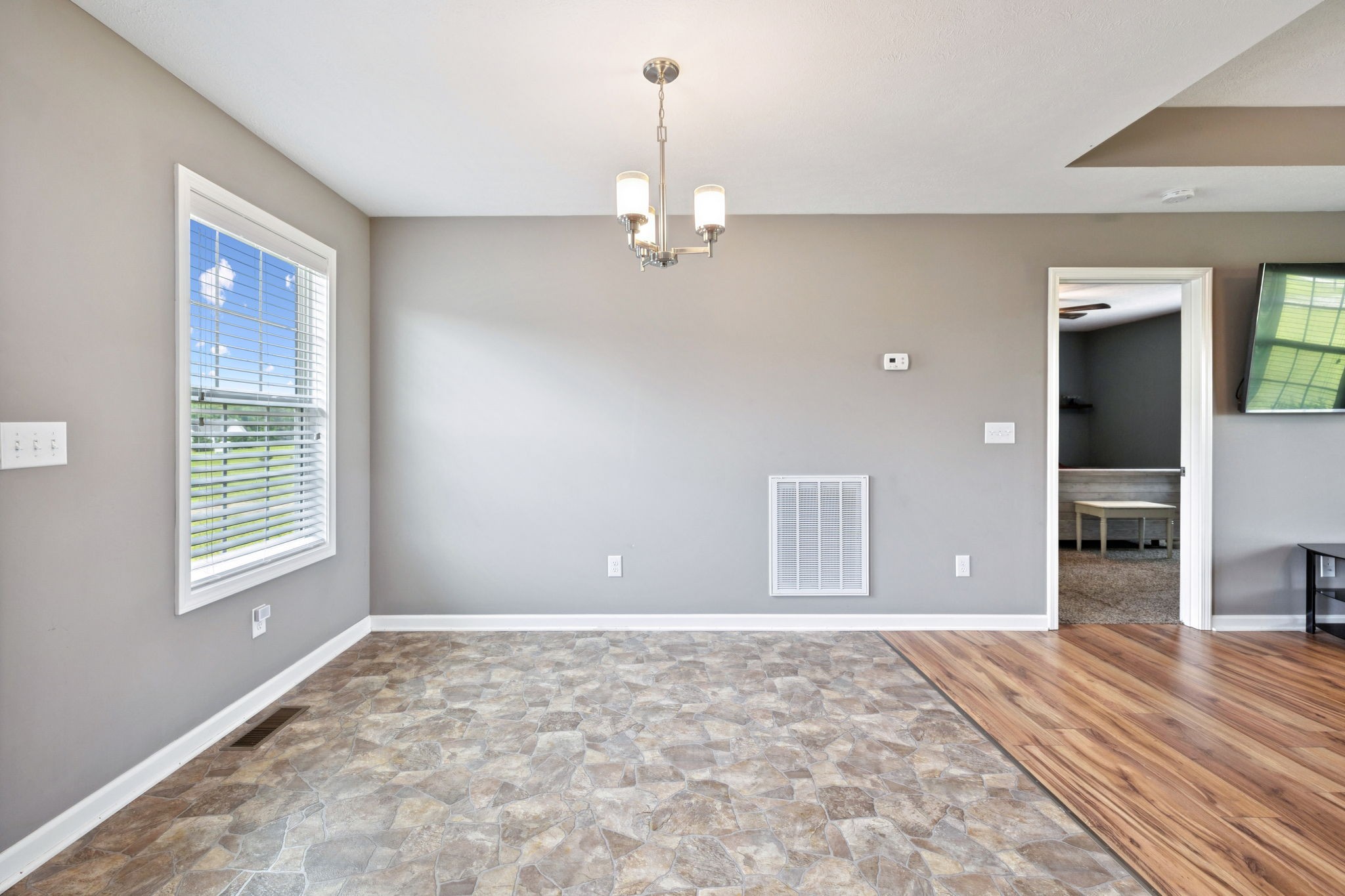 819 White Road Portland, TN 37148 - Photo 5 of 21 an empty room with window and wooden floor