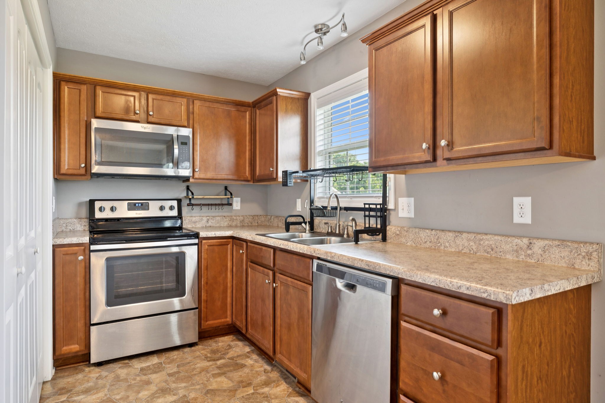 819 White Road Portland, TN 37148 - Photo 7 of 21 a kitchen with stainless steel appliances granite countertop a sink stove and microwave