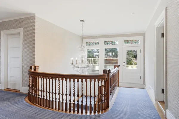 a view of a balcony with wooden floor
