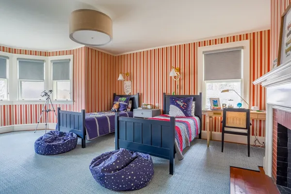 a bed room with furniture and a window