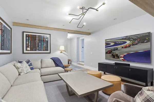 a living room with furniture a desk and chair