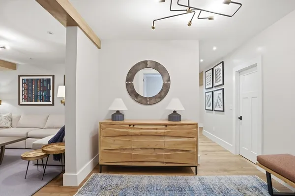 a view of room with furniture and a wooden floor