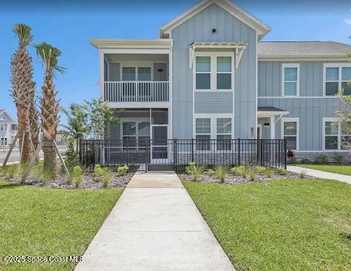1073 Journey Circle, Unit 106 Rockledge, FL 32955 - Photo 1 of 10 front view of a house with a yard