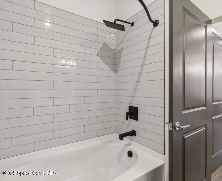 1073 Journey Circle, Unit 106 Rockledge, FL 32955 - Photo 10 of 10 a bathroom with a bathtub