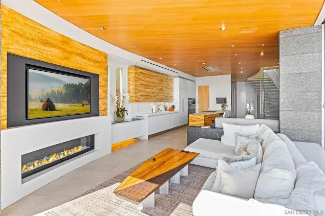 a view of a swimming pool with a dining table and chairs
