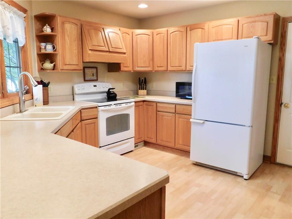 5635 Lamor Road Hermitage, PA 16148 - Photo 8 of 21 Lovely kitchen with breakfast bar and appliance package.