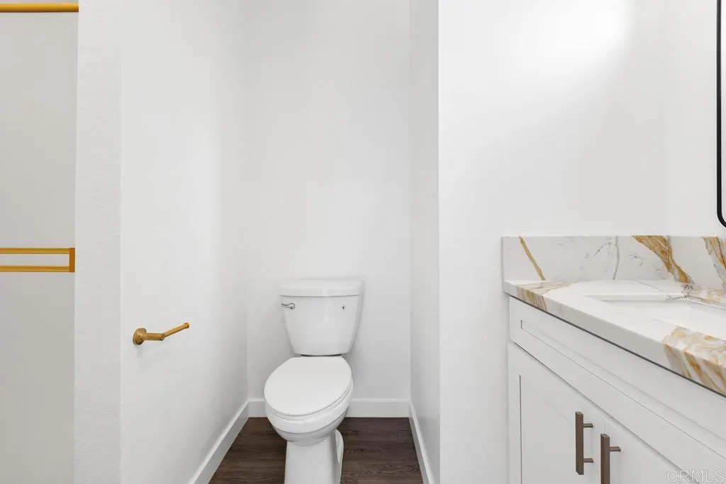 889 Bracero Road Encinitas, CA 92024 - Photo 50 of 59 a close view of a sink and a toilet in a bathroom