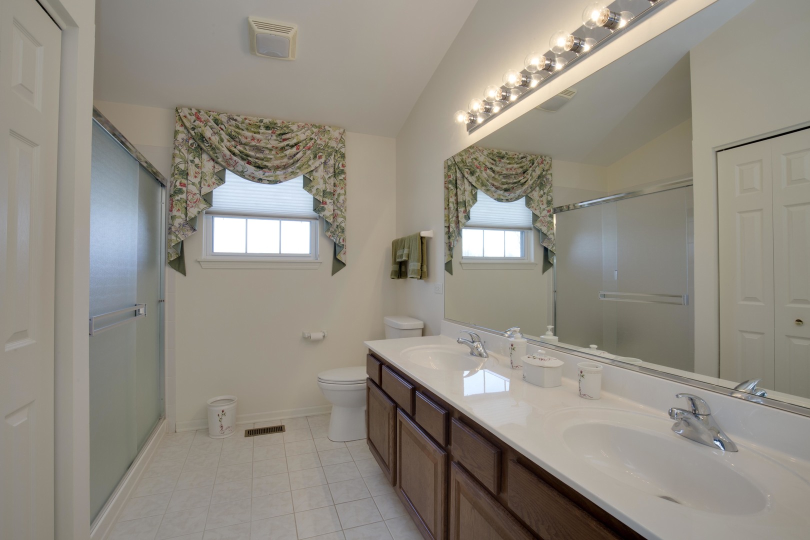 9610 Newton Road Huntley, IL 60142 - Photo 14 of 23 a spacious bathroom with a double vanity and a mirror