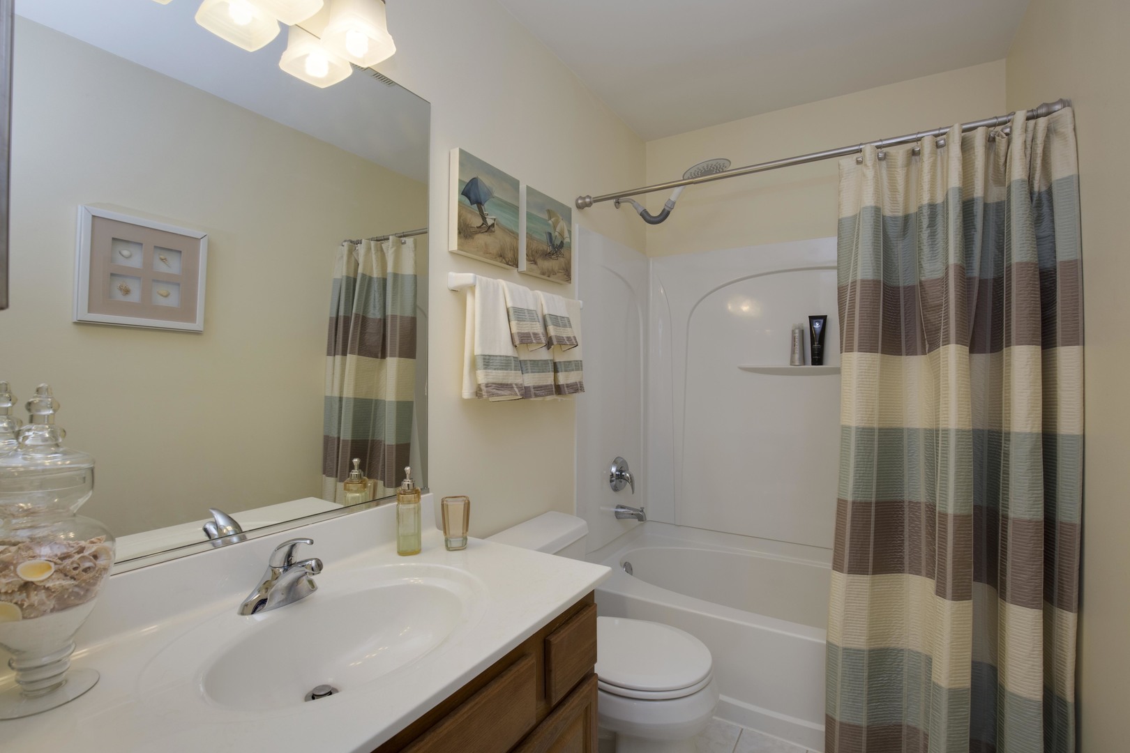 9610 Newton Road Huntley, IL 60142 - Photo 16 of 23 a bathroom with a sink toilet a shower and a mirror