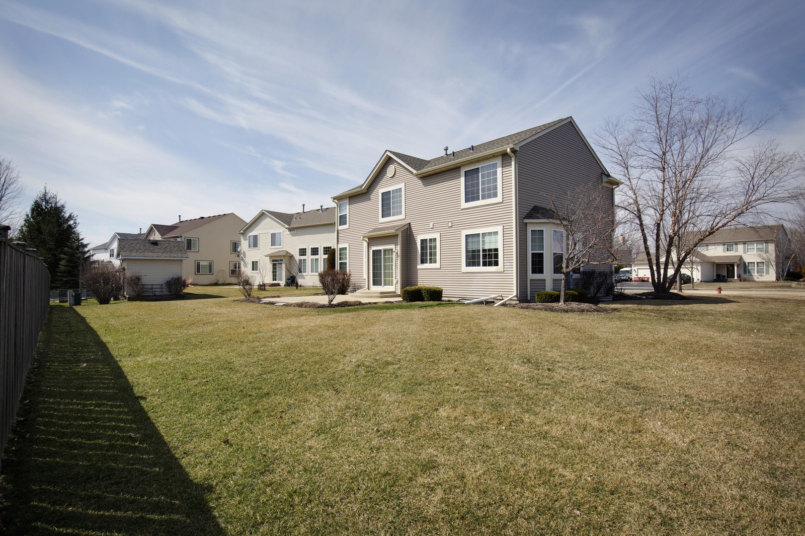 9610 Newton Road Huntley, IL 60142 - Photo 19 of 23 a front view of a house with a yard