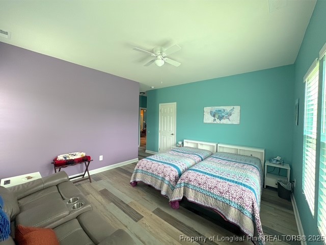 893 Blanchard Road St. Pauls, NC 28384 - Photo 14 of 32 a bedroom with a bed and a chandelier