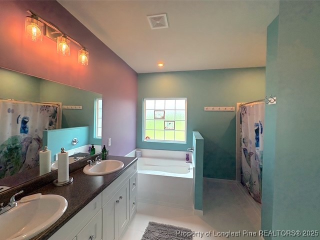 893 Blanchard Road St. Pauls, NC 28384 - Photo 16 of 32 a bathroom with a double vanity sink toilet and shower