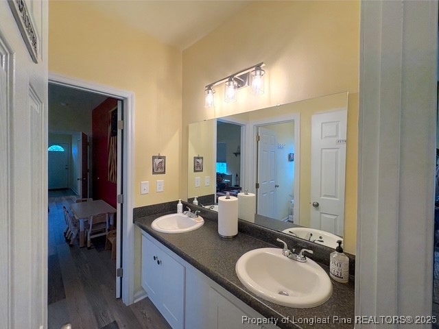 893 Blanchard Road St. Pauls, NC 28384 - Photo 18 of 32 a en suite bathroom with a sink double vanity and a mirror