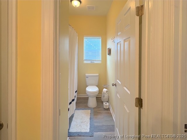 893 Blanchard Road St. Pauls, NC 28384 - Photo 19 of 32 a bathroom with a granite countertop toilet and a shower