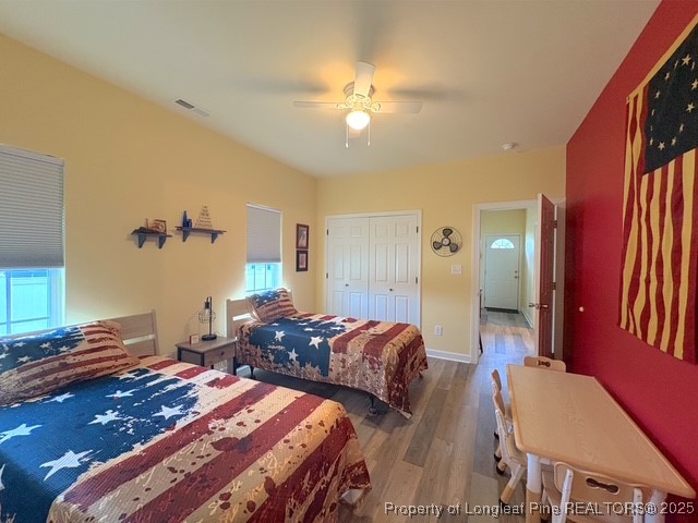 893 Blanchard Road St. Pauls, NC 28384 - Photo 20 of 32 a bedroom with two beds and a chandelier
