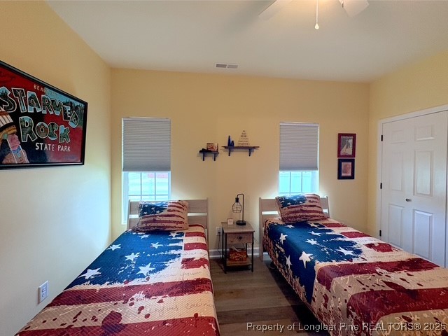 893 Blanchard Road St. Pauls, NC 28384 - Photo 21 of 32 a bedroom with a bed and wooden floor