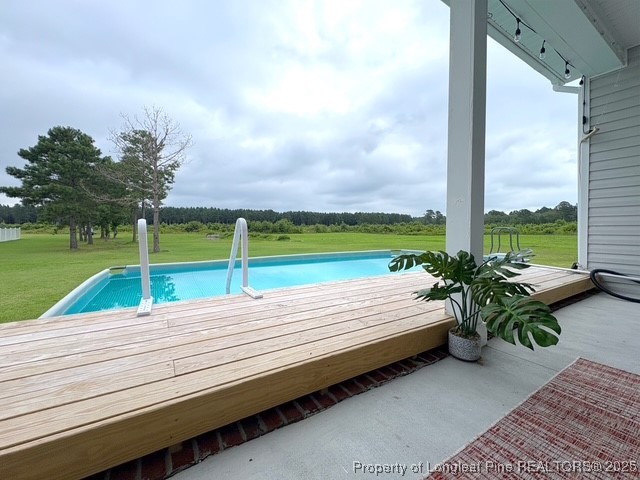893 Blanchard Road St. Pauls, NC 28384 - Photo 29 of 32 a view of a wooden deck with a big yard
