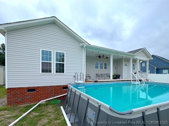 893 Blanchard Road St. Pauls, NC 28384 - Photo 30 of 32 a view of house with a backyard and a patio