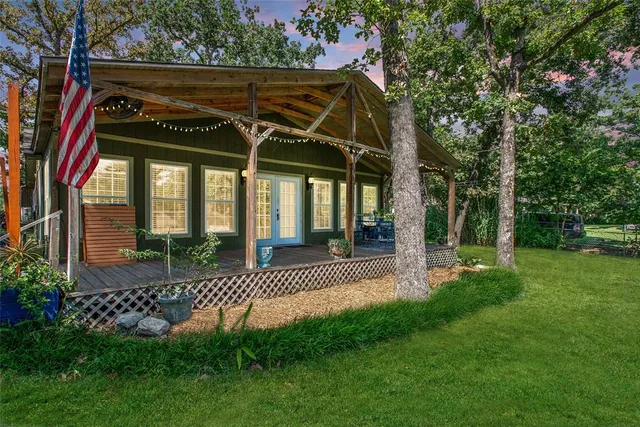 a view of a car park in front of a house