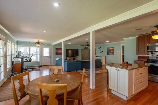 a view of a dining room with furniture window and wooden floor