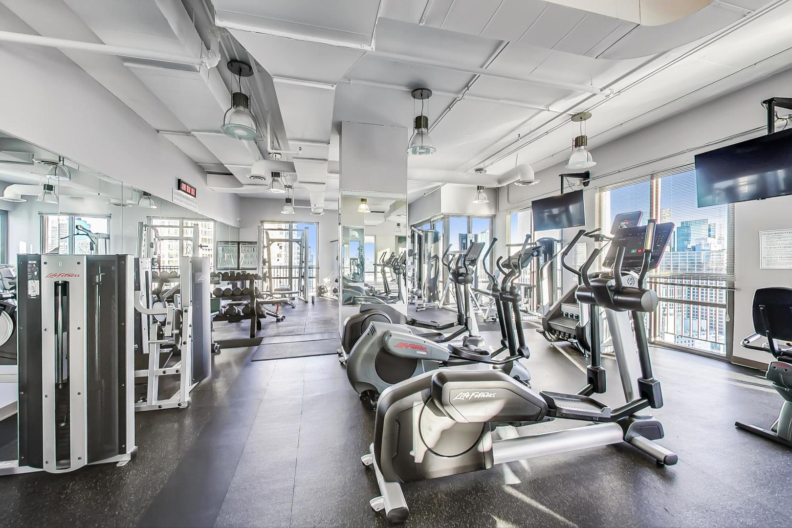 2 East Erie Street, Unit 2204 Chicago, IL 60611 - Photo 15 of 19 a view of a room with gym equipment