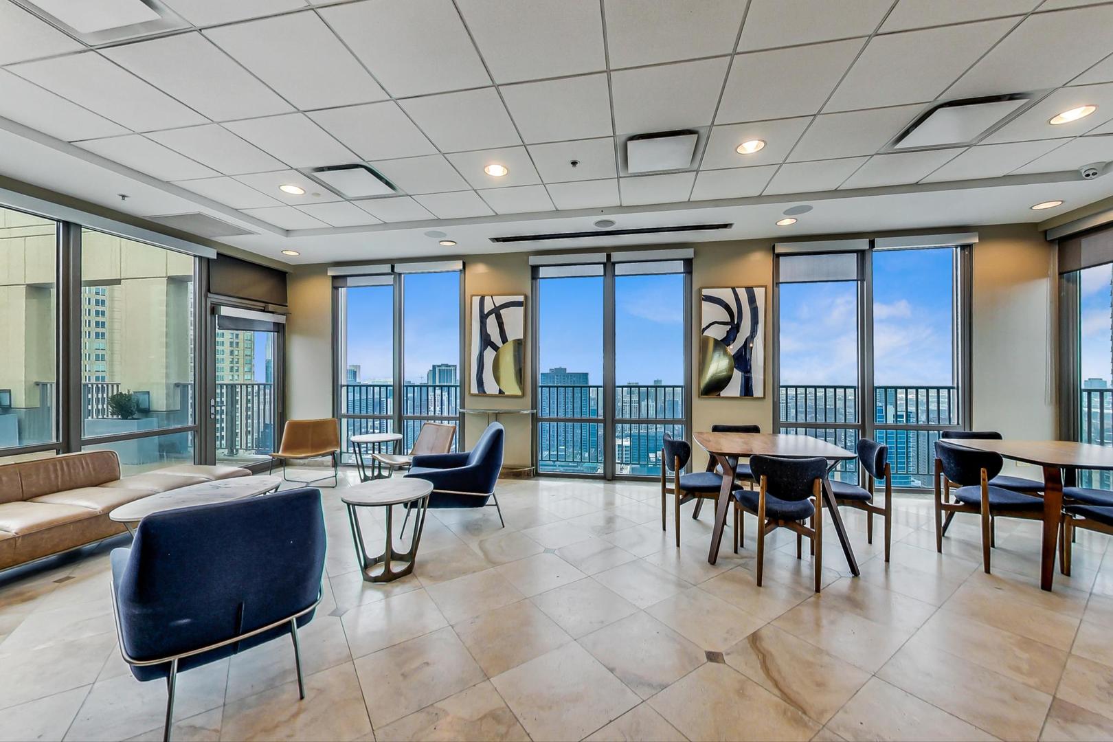 2 East Erie Street, Unit 2204 Chicago, IL 60611 - Photo 16 of 19 a lobby with furniture and floor to ceiling window