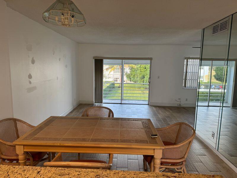 5401 Northwest 2nd Avenue, Unit 219 Boca Raton, FL 33487 - Photo 4 of 15 a room with furniture and window