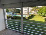 5401 Northwest 2nd Avenue, Unit 219 Boca Raton, FL 33487 - Photo 5 of 15 a view of a glass door