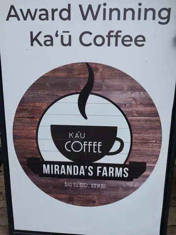 a view of a street with a house in the background