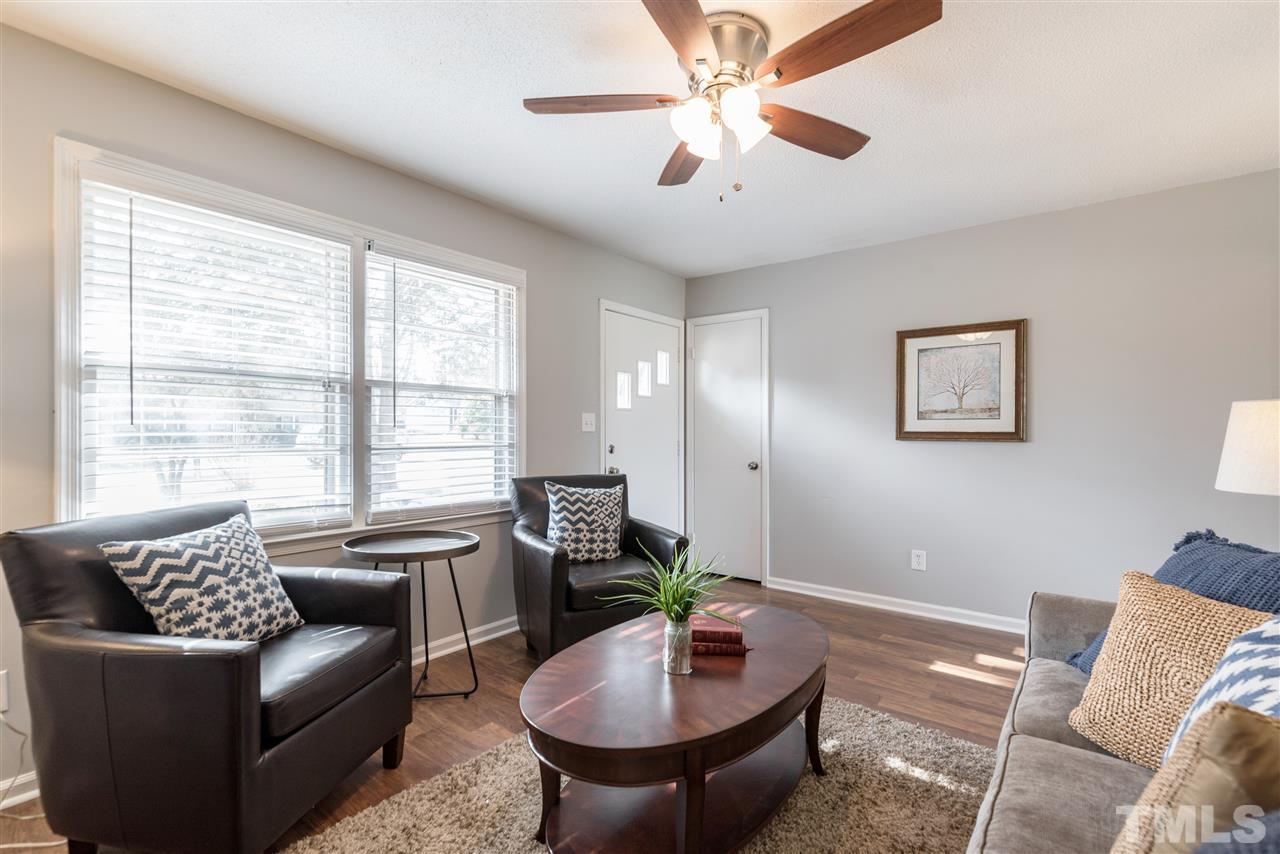 8608 Stonegate Drive Raleigh, NC 27615 - Photo 5 of 25 a living room with furniture and a large window