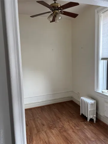 a kitchen with a refrigerator and a stove