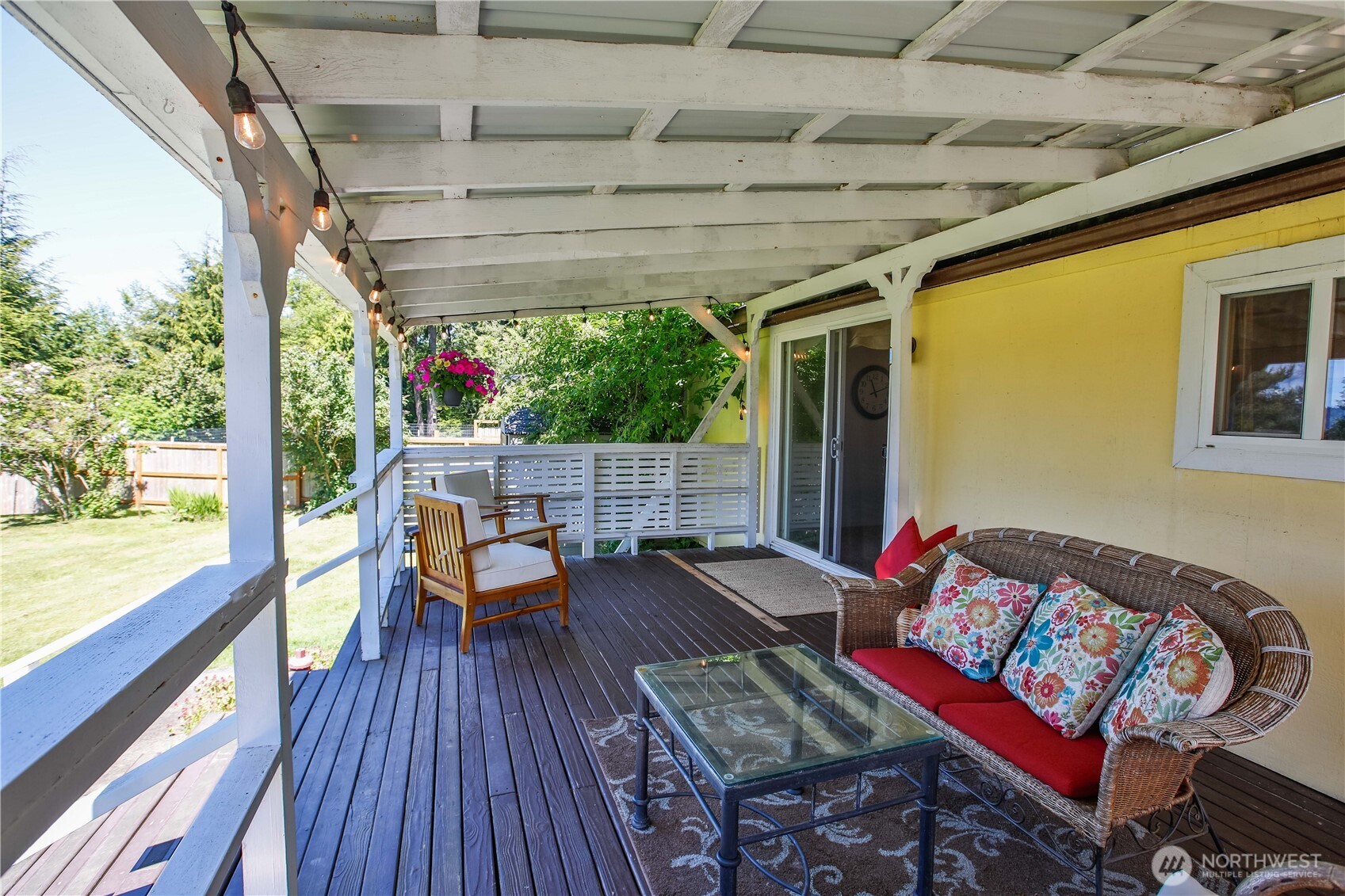 3276 East Harbor Road Langley, WA 98260 - Photo 12 of 37 a balcony with furniture and wooden floor