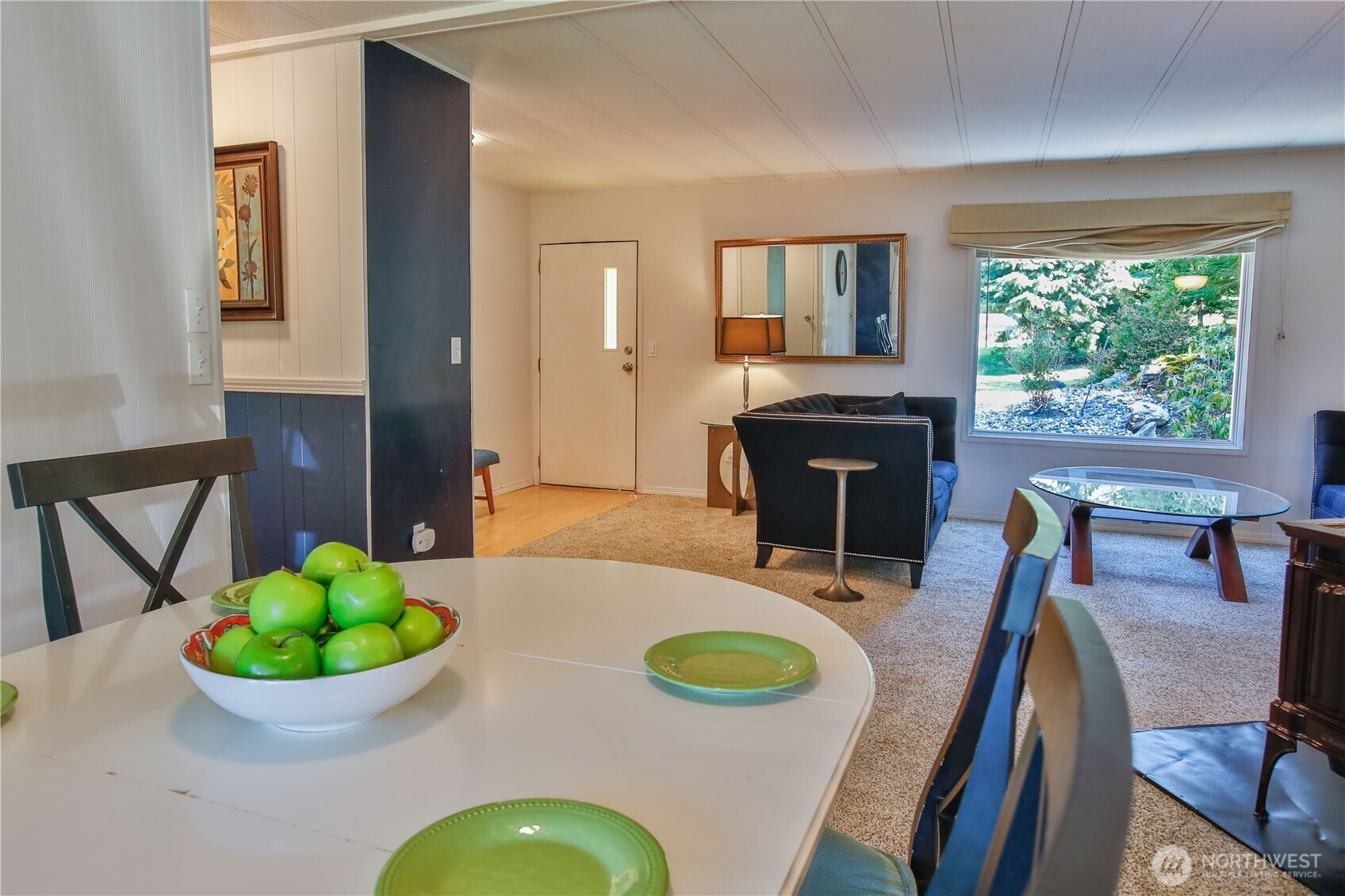 3276 East Harbor Road Langley, WA 98260 - Photo 13 of 37 a view of a dining room with furniture window and wooden floor