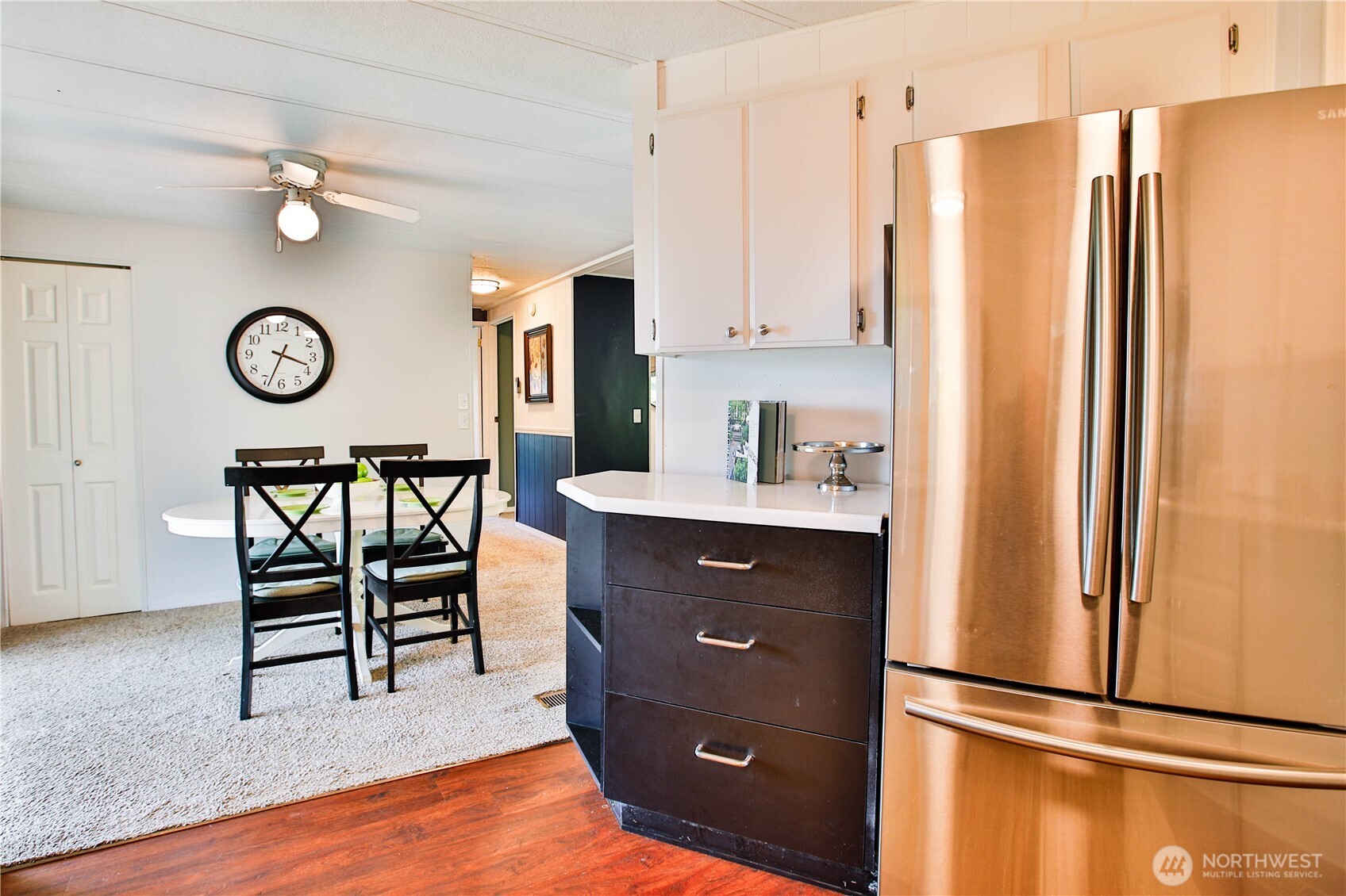 3276 East Harbor Road Langley, WA 98260 - Photo 18 of 37 a kitchen with stainless steel appliances granite countertop a refrigerator and a stove top oven