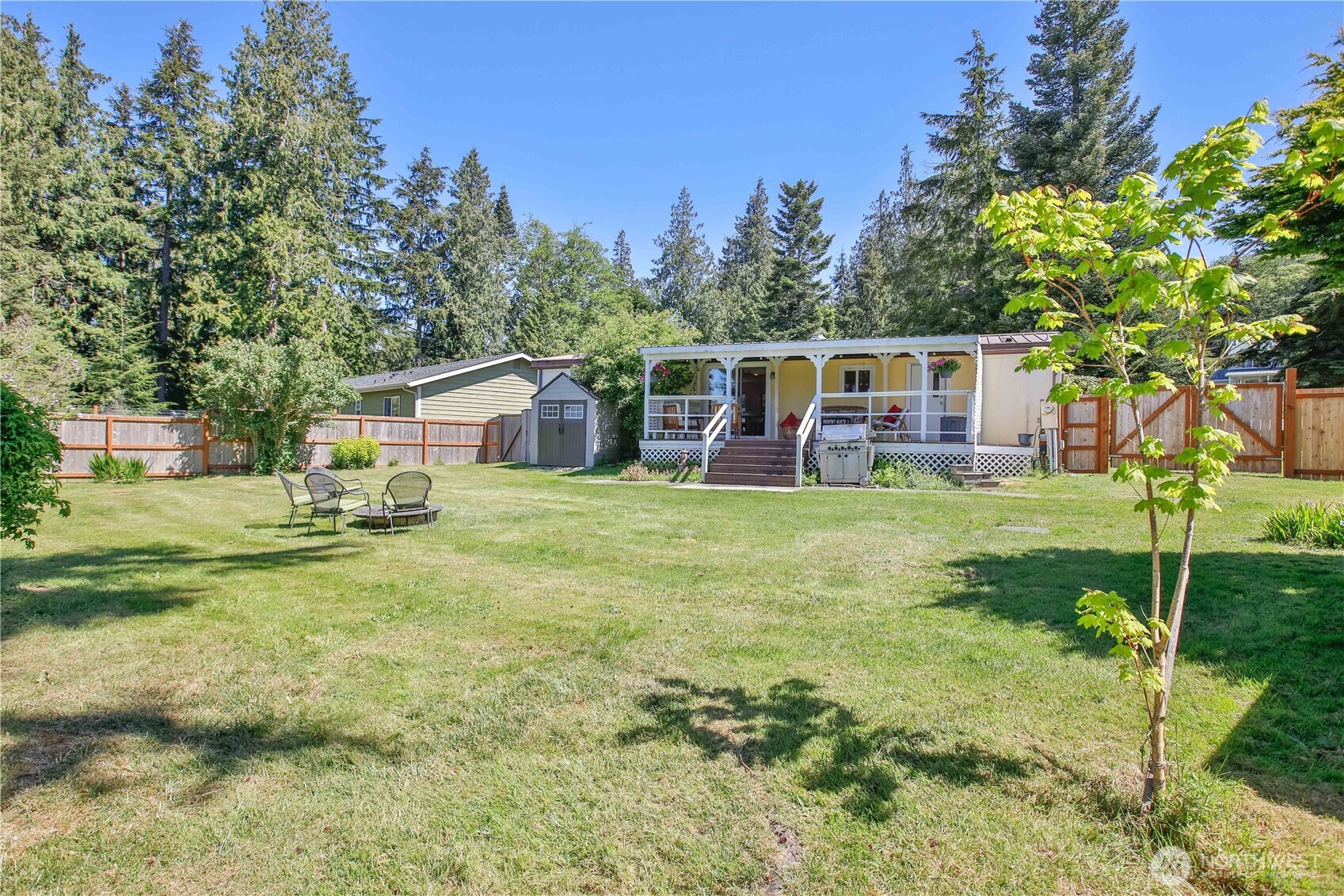3276 East Harbor Road Langley, WA 98260 - Photo 2 of 37 a view of a house with backyard and sitting area