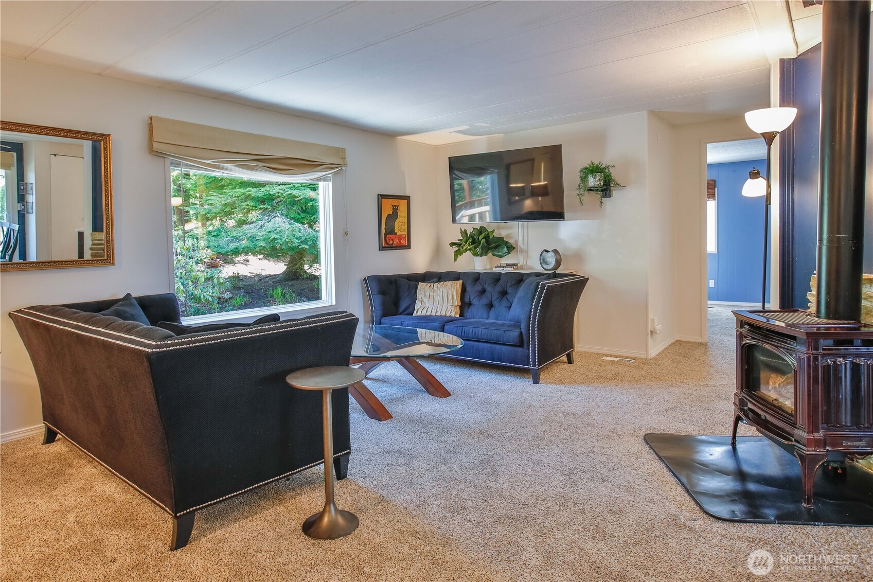 3276 East Harbor Road Langley, WA 98260 - Photo 21 of 37 a living room with furniture and a fireplace