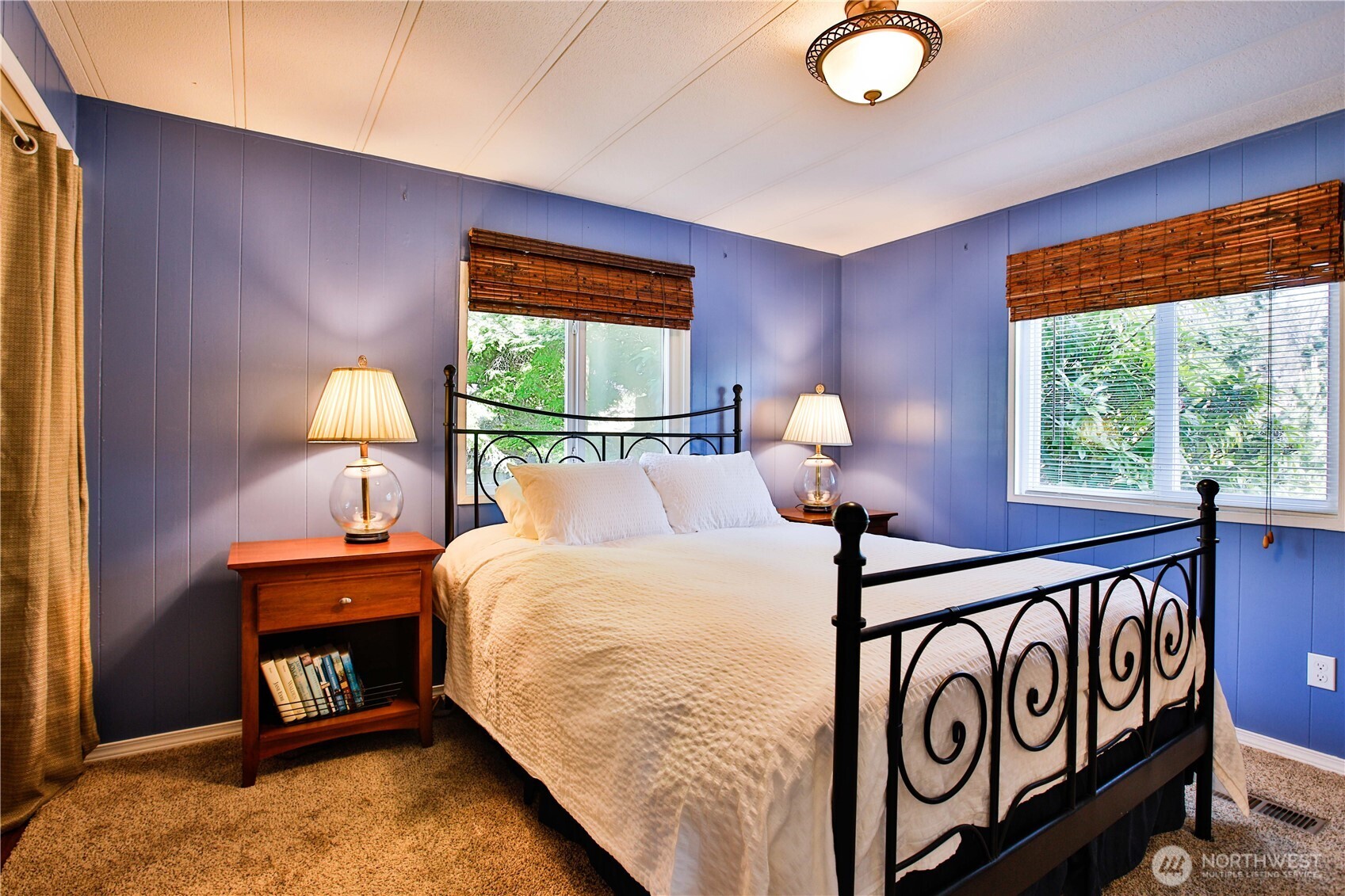 3276 East Harbor Road Langley, WA 98260 - Photo 22 of 37 a bedroom with a bed and a window