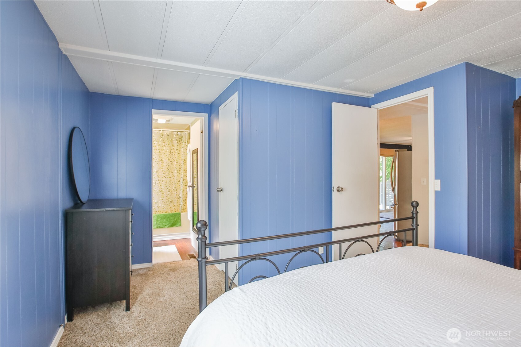 3276 East Harbor Road Langley, WA 98260 - Photo 24 of 37 a bedroom with a bed and a flat screen tv